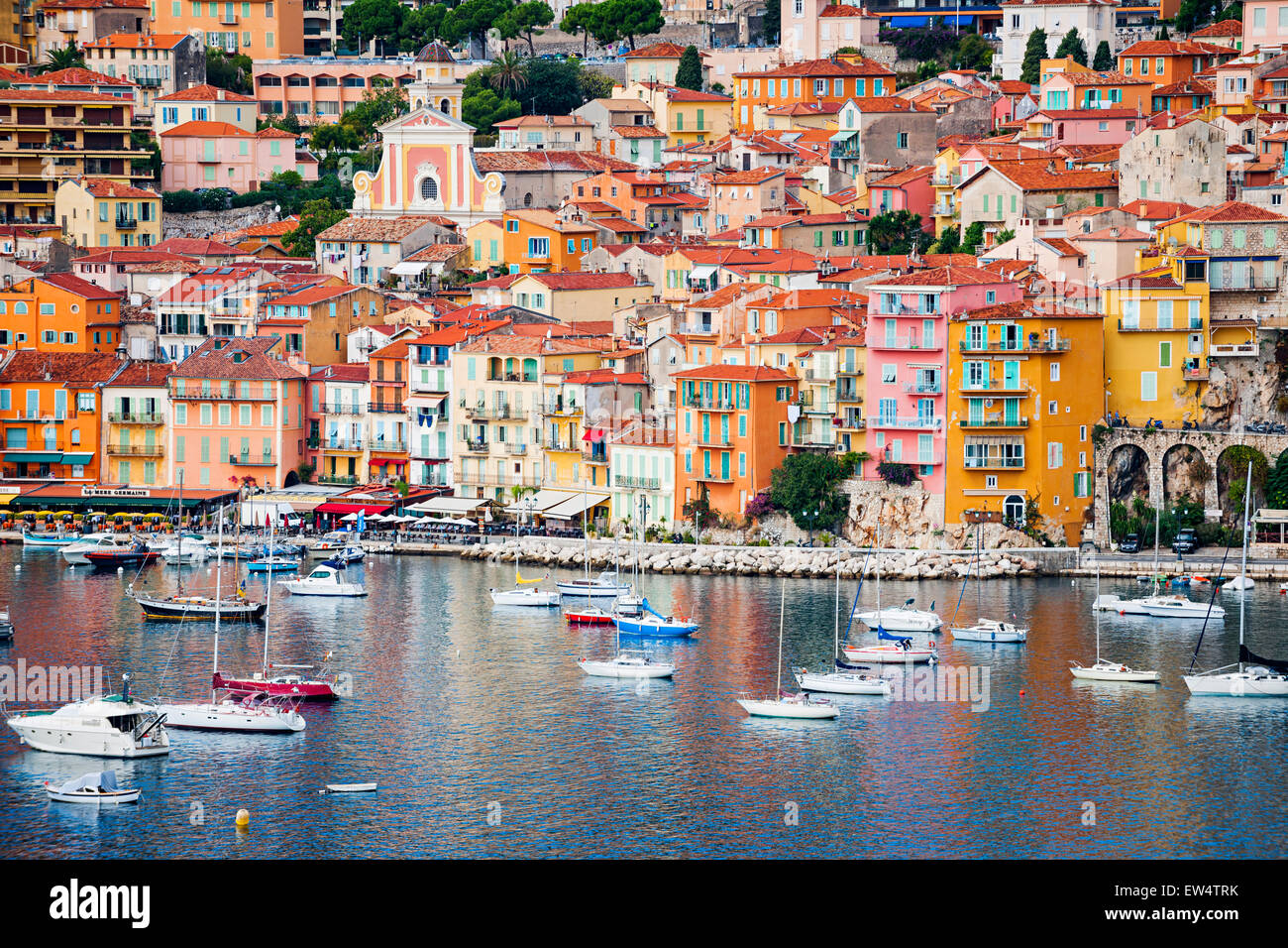 VILLEFRANCHE-SUR-MER, FRANCE - OCTOBER 1, 2014: Colorful waterfront of picturesque French Riviera town with leisure boats anchor Stock Photo
