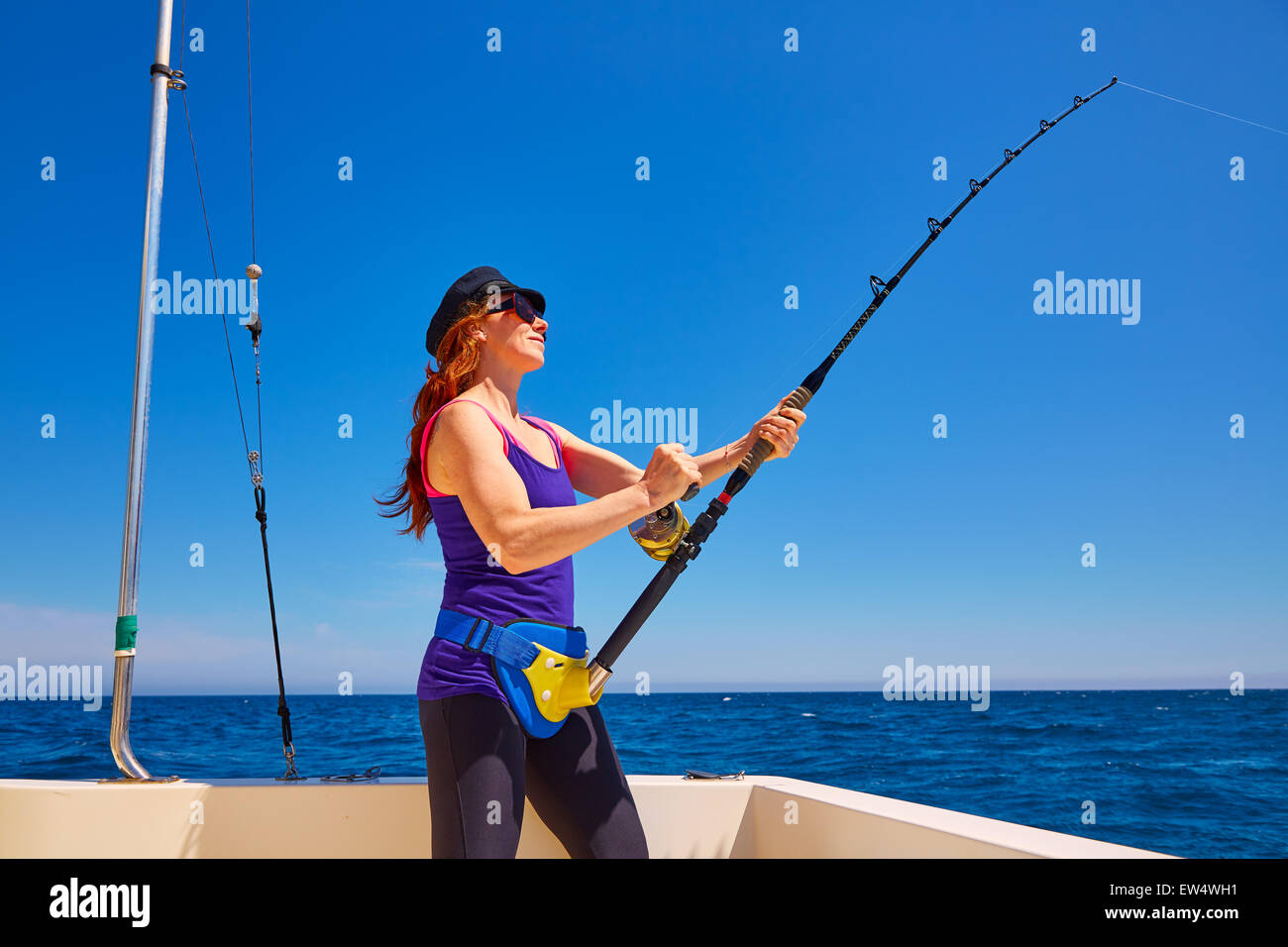 https://c8.alamy.com/comp/EW4WH1/beautiful-woman-girl-fishing-rod-trolling-in-saltwater-in-a-boat-trolling-EW4WH1.jpg