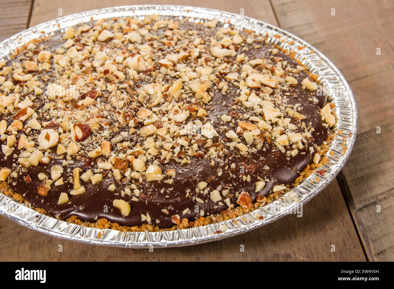 Chocolate pie with hazelnut frosted topping Stock Photo