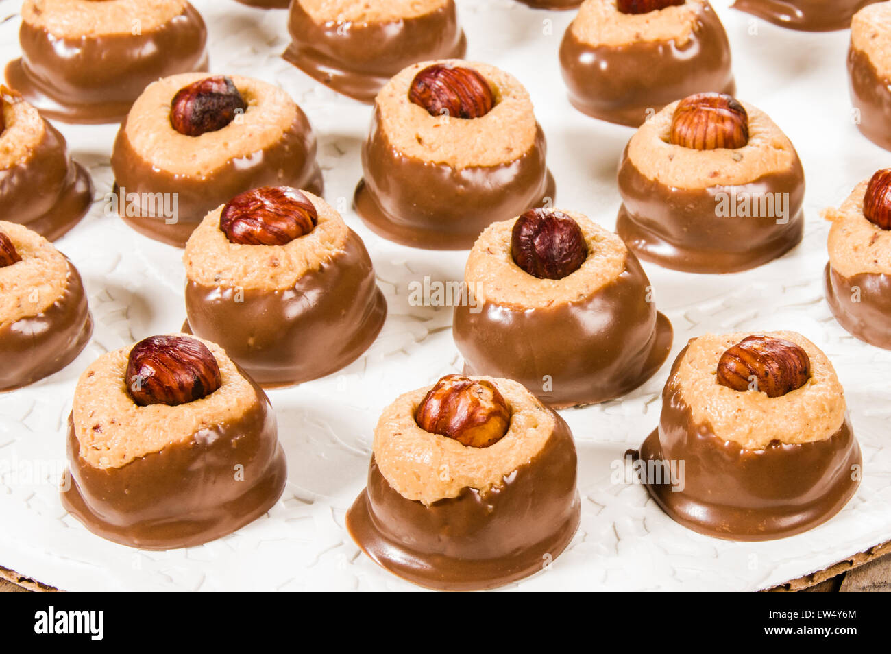 Peanut butter chocolate dipped candy with hazelnut Stock Photo Alamy