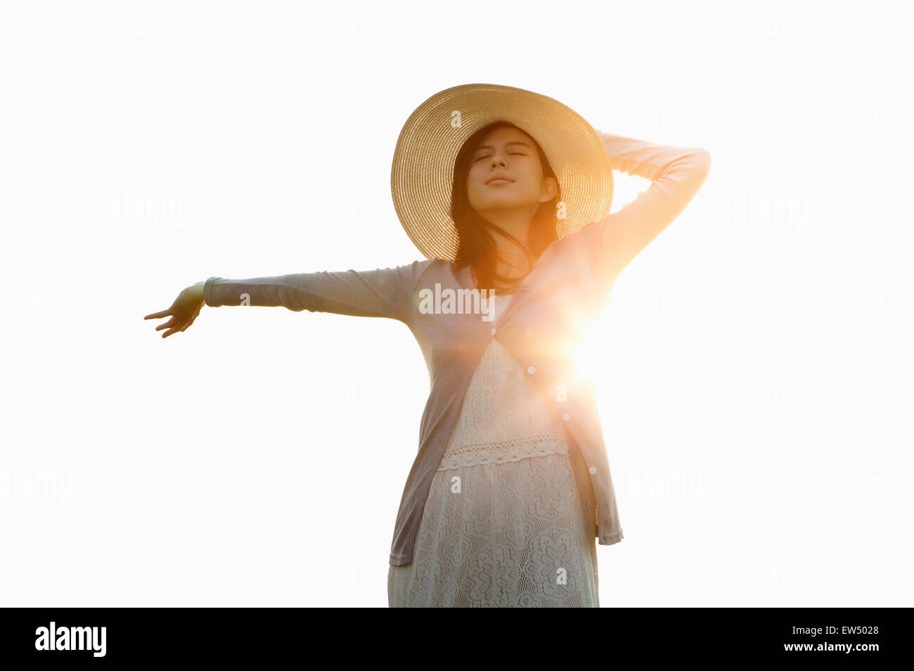 Woman arms outstretched sun hi-res stock photography and images - Alamy