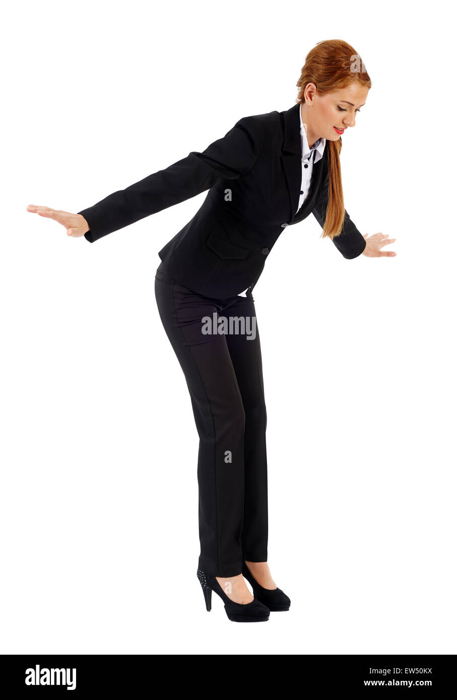 Full length portrait of a young businesswoman falling down, isolated on white Stock Photo