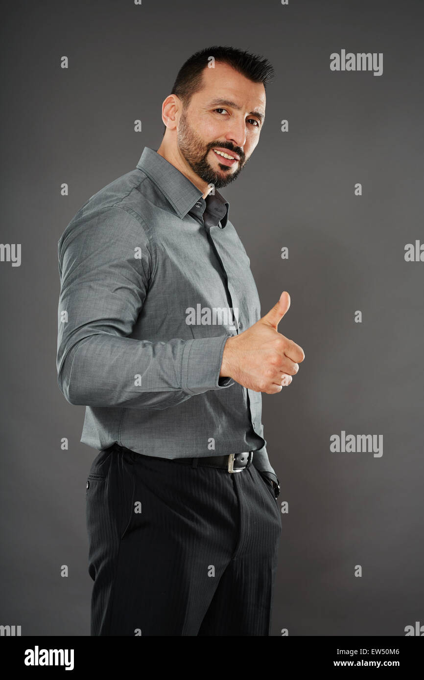 Businessman showing thumbs up sign hi-res stock photography and images ...