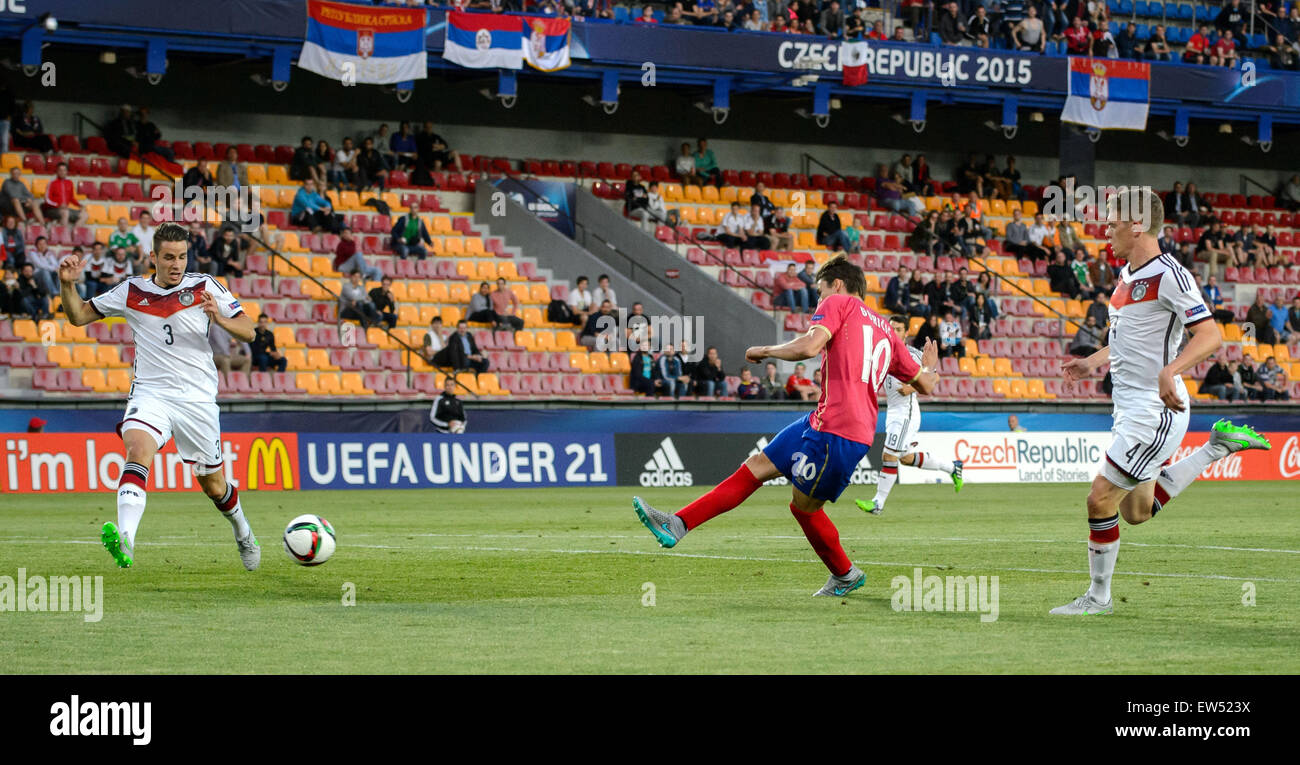 Prague, Czech Republic. 17th June, 2015. Filip Djuricic (C) Serbia scores the opening goal against Germany's Christian Guenter (L) and Matthias Ginter during the UEFA Under-21 European Championships 2015 group A soccer match between Germany and Serbia at Stock Photo
