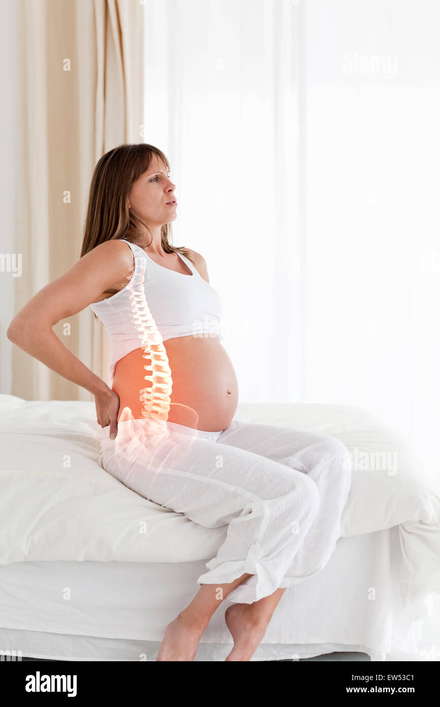 Highlighted spine of pregnant woman Stock Photo