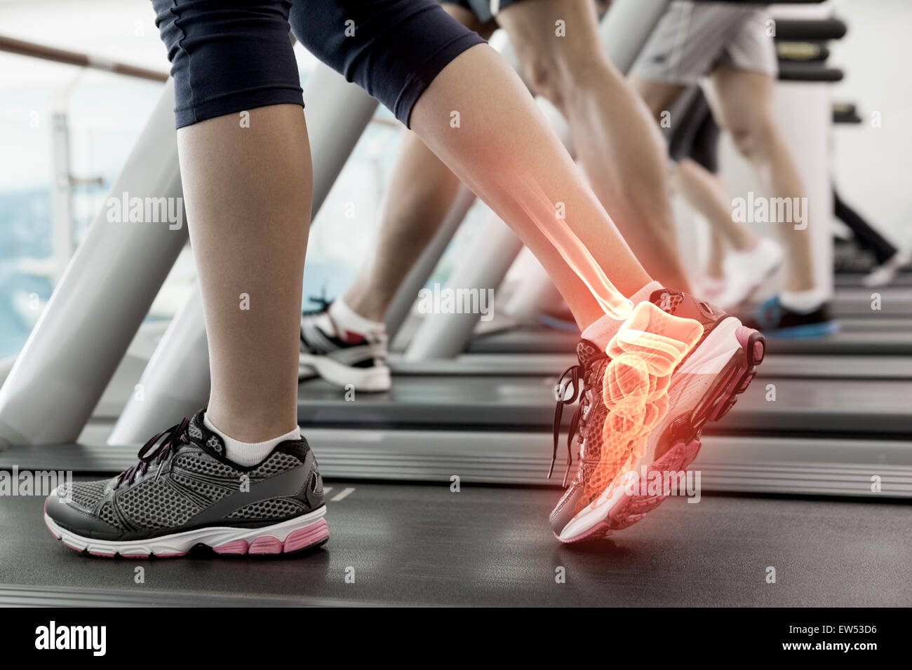 Highlighted ankle of woman on treadmill Stock Photo