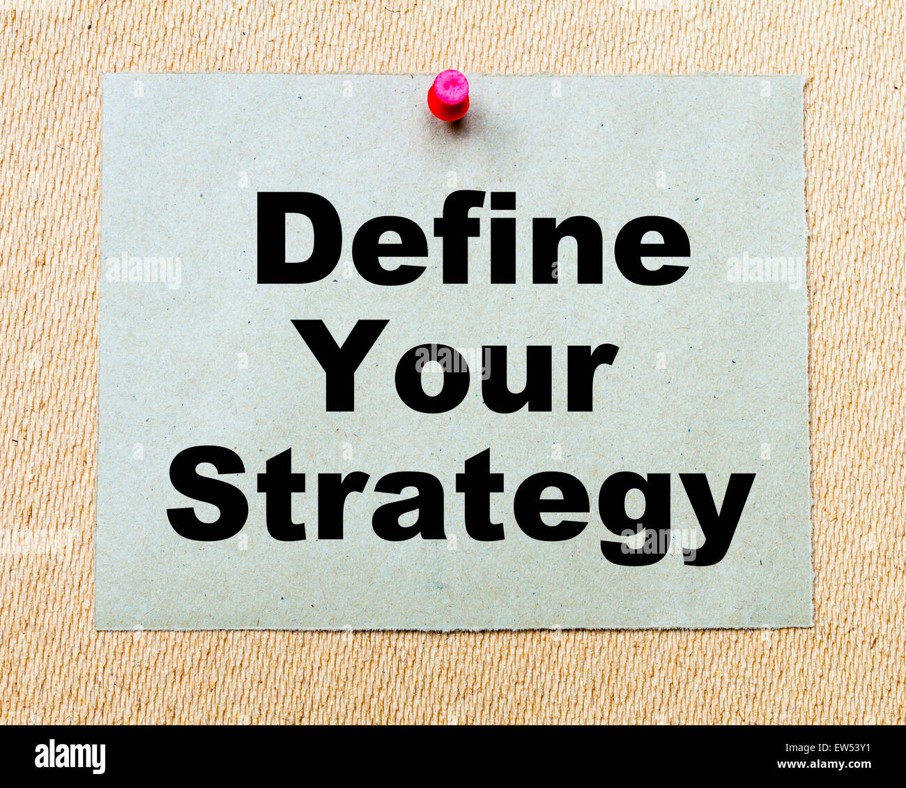 Define Your Strategy  written on paper note pinned with red thumbtack on wooden board. Business conceptual Image Stock Photo