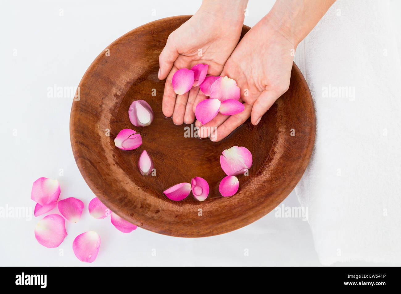 Petals of flower in wooden bowl Stock Photo