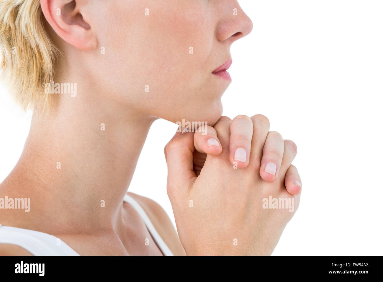 Pretty blonde woman praying Stock Photo