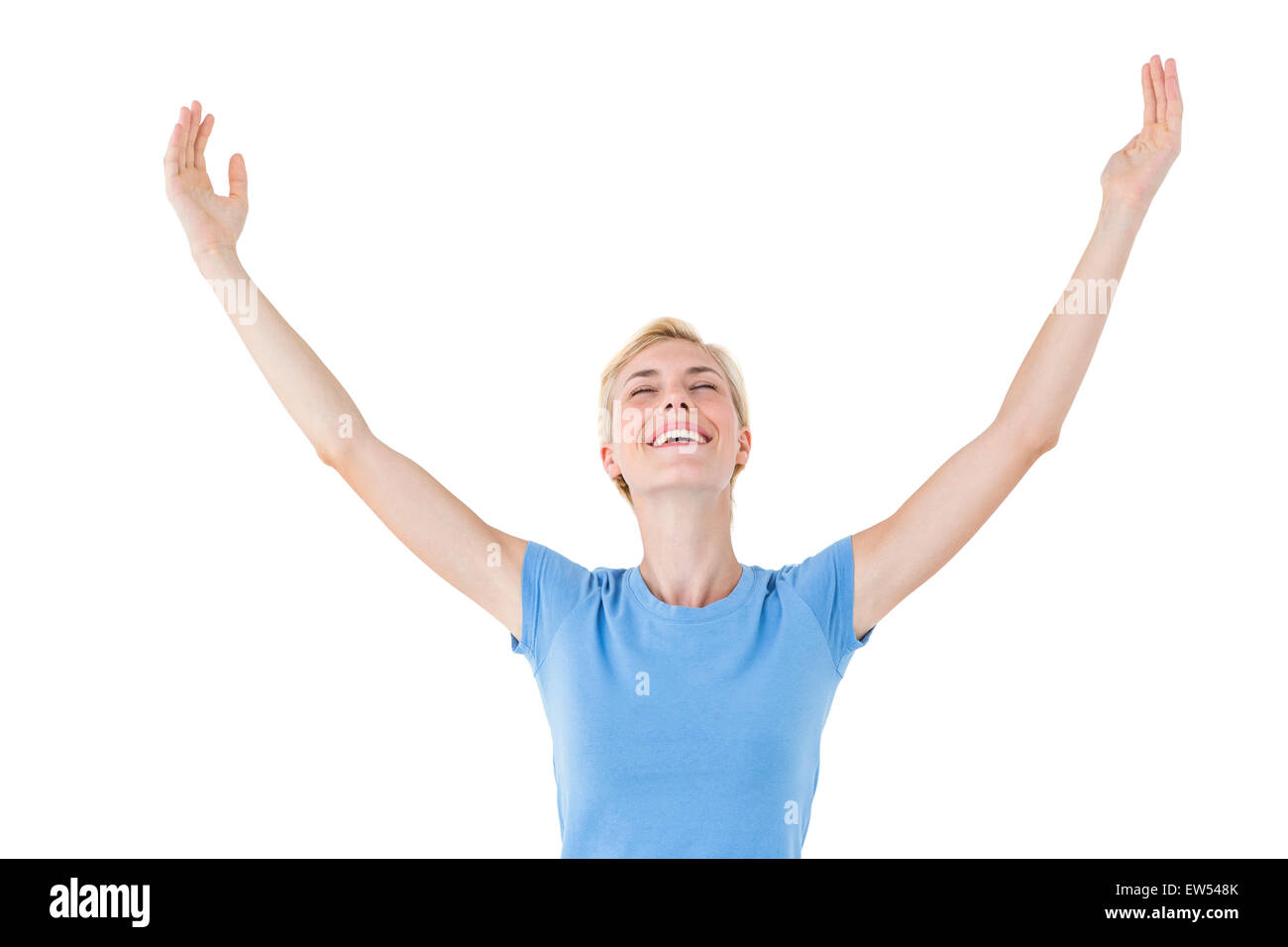 Blonde woman standing arms outstretched Stock Photo