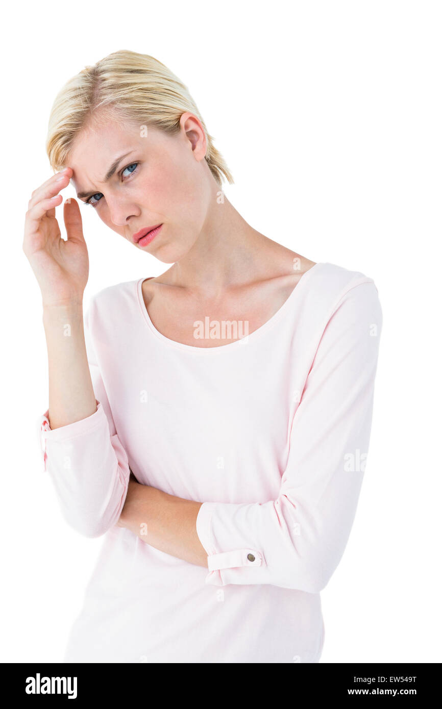 Thoughtful blonde woman looking at camera Stock Photo