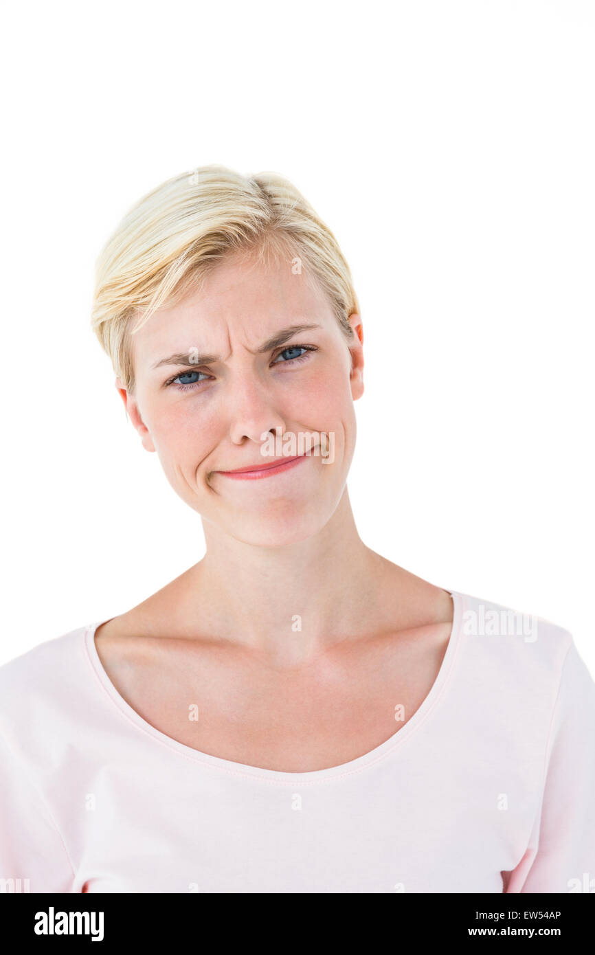 Confused blonde woman looking at camera Stock Photo