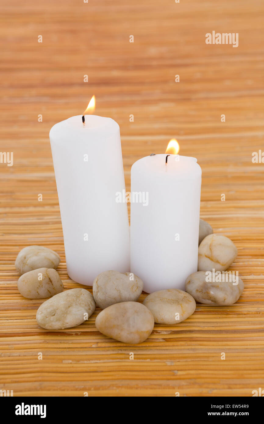 Candles with pebbles Stock Photo
