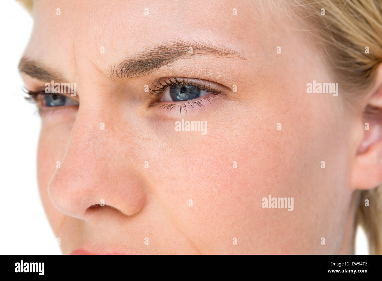 Serious blond woman looking away Stock Photo