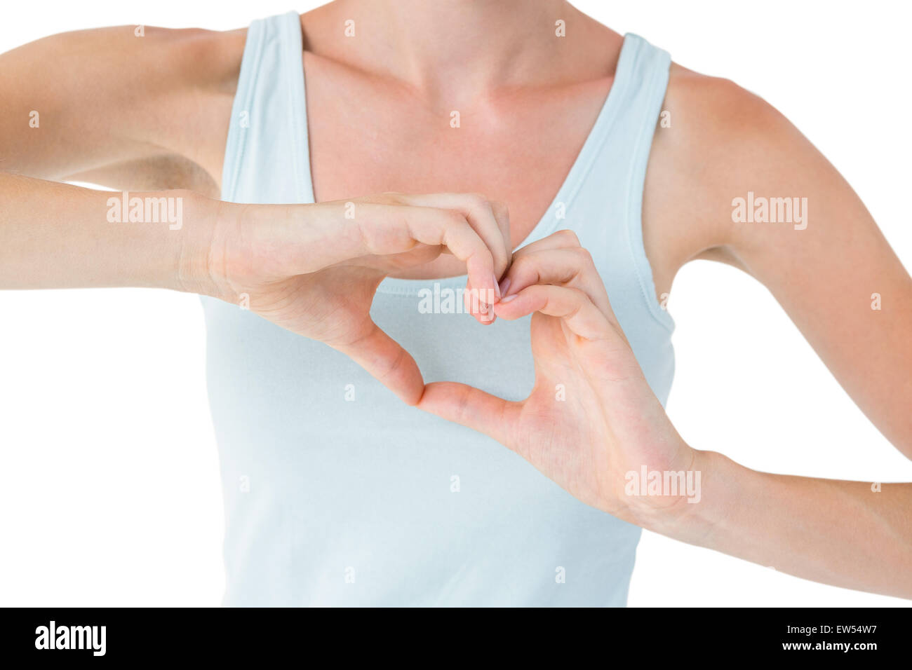 Fit woman doing heart shape with her hands Stock Photo