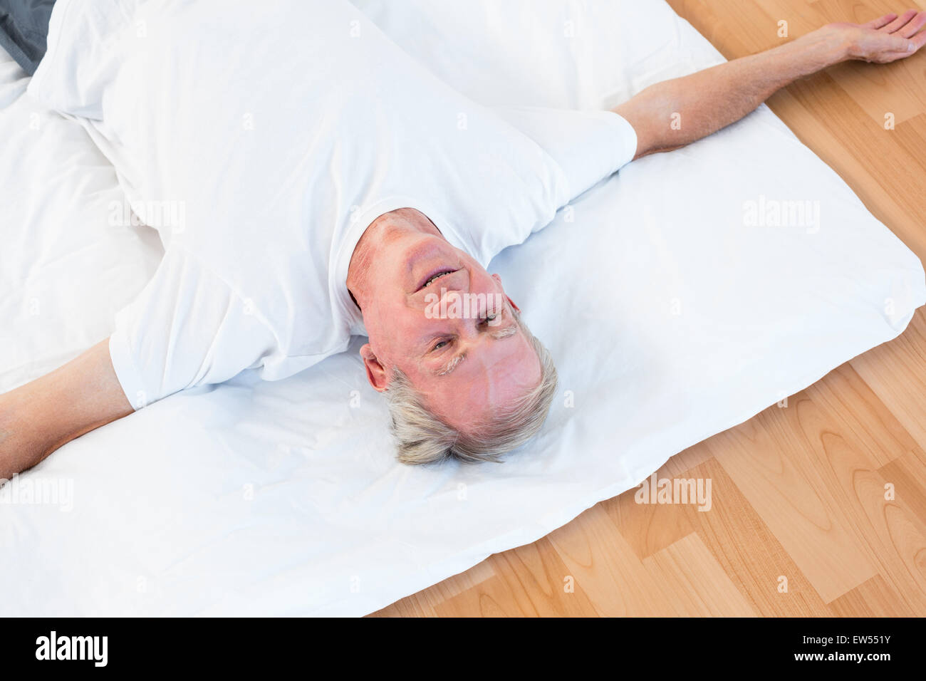 Old man lying floor hi-res stock photography and images - Alamy