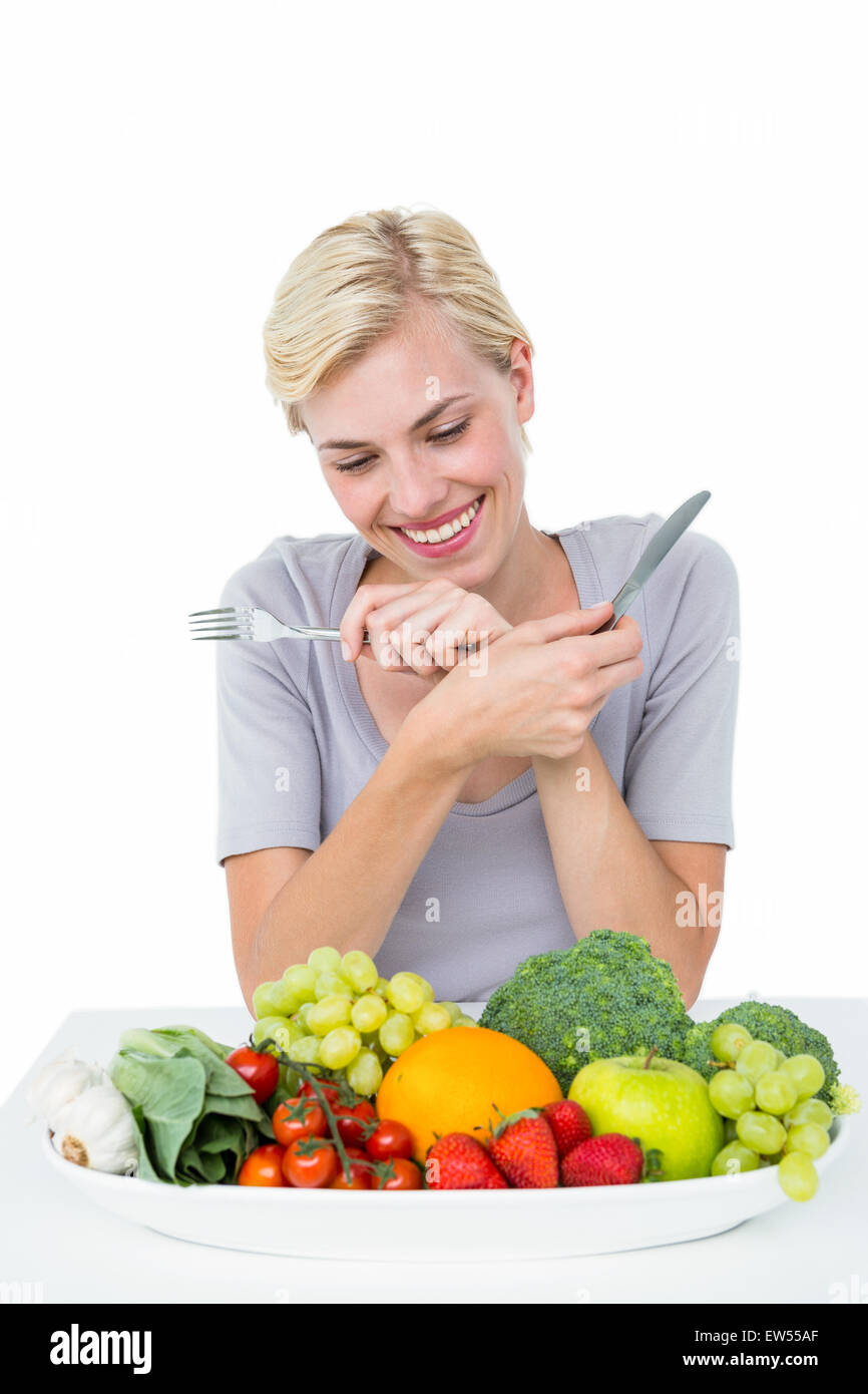 Happy blonde woman sitting above healthy food Stock Photo