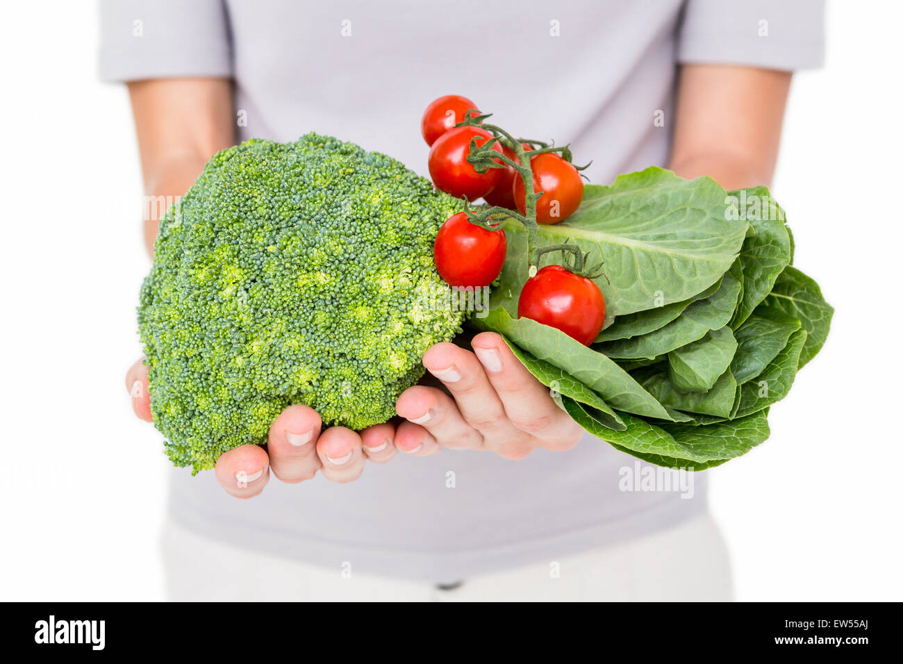 Woman holding vegetables Stock Photo