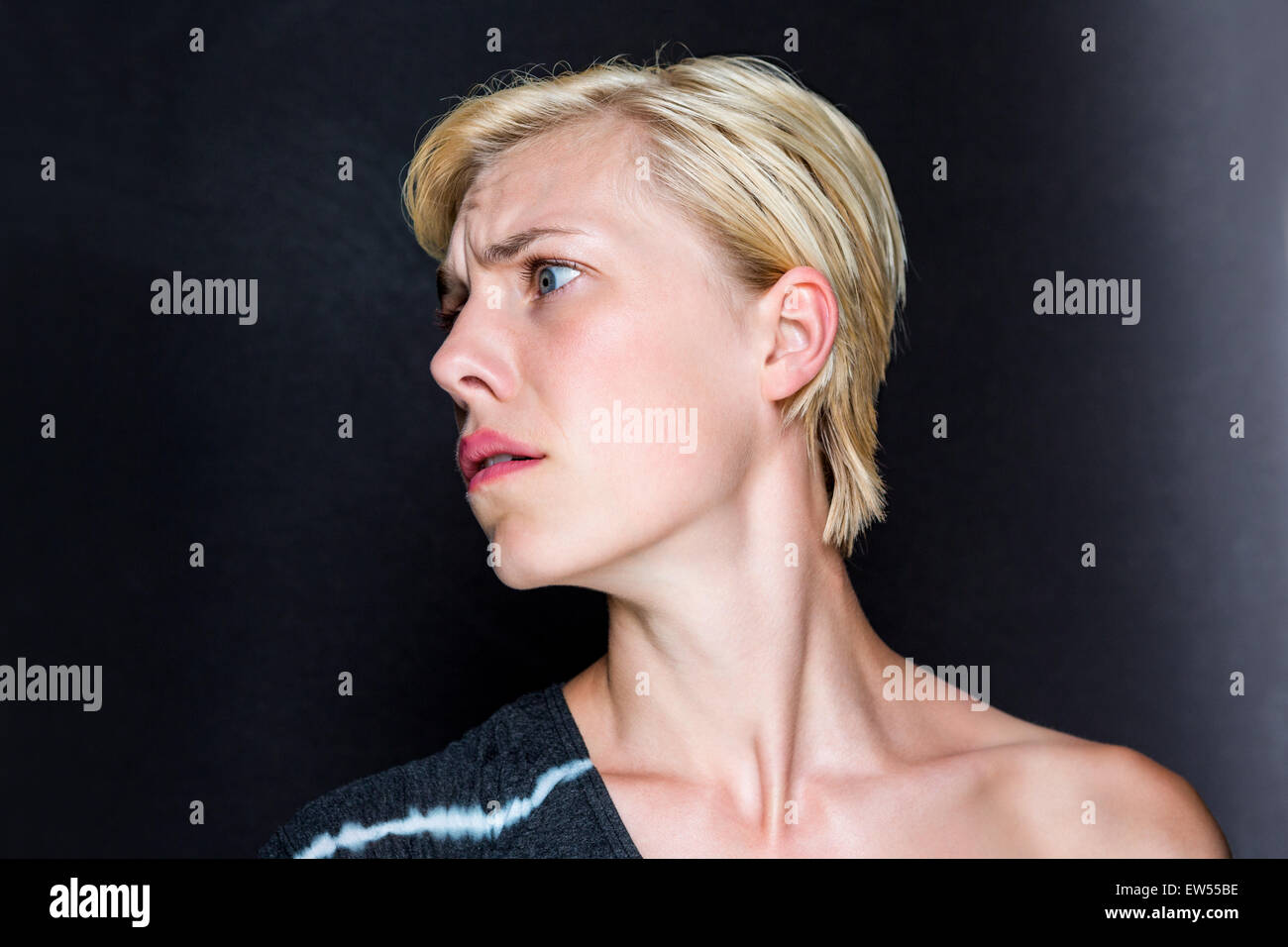 Anxious blonde woman Stock Photo