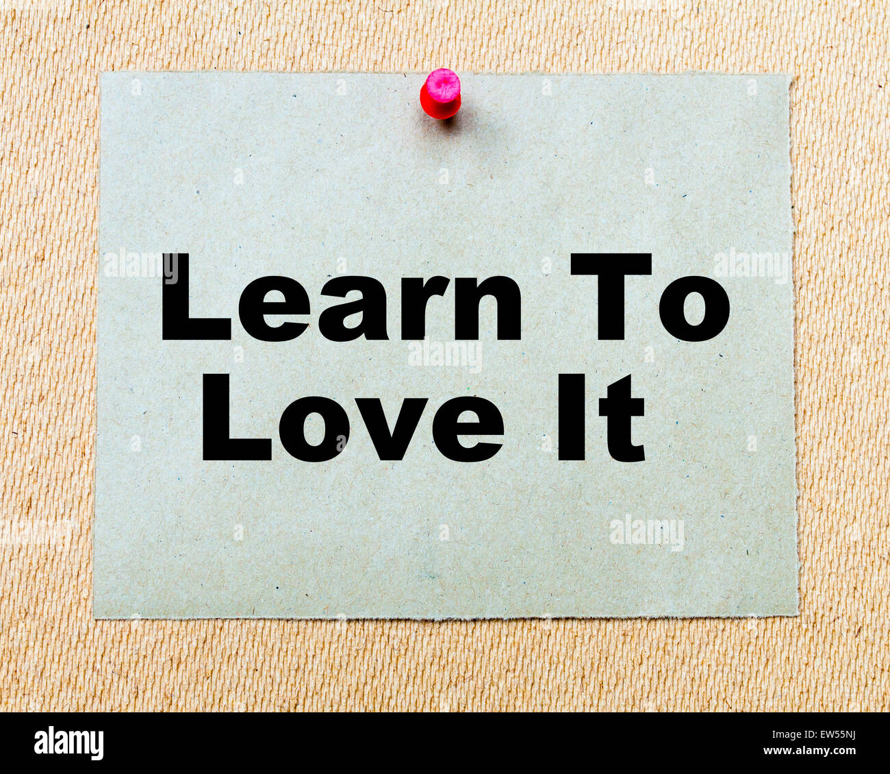 Learn To Love It written on paper note pinned with red thumbtack on ...