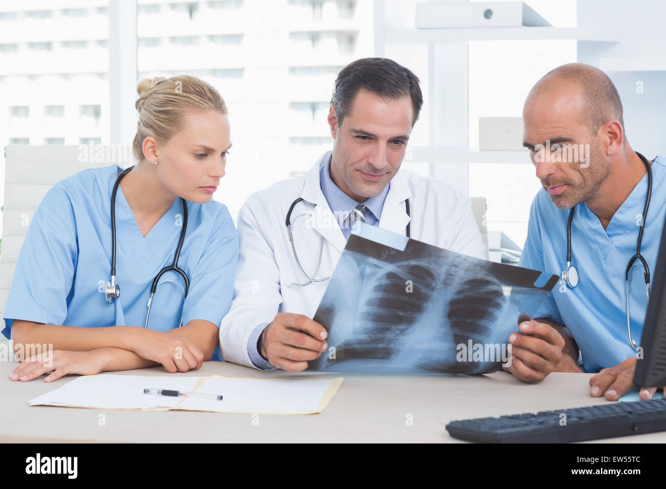 Mature doctor smiling colleagues hi-res stock photography and images ...