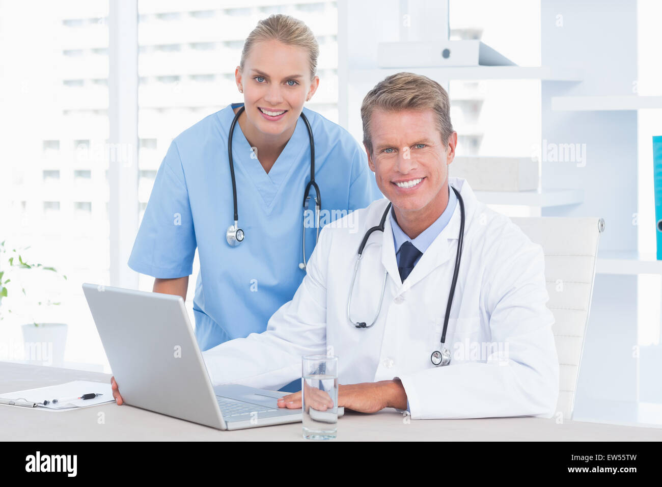 Doctor nurse looking camera hi-res stock photography and images - Alamy