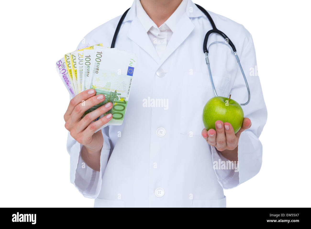 Doctor holding cash and green apple Stock Photo