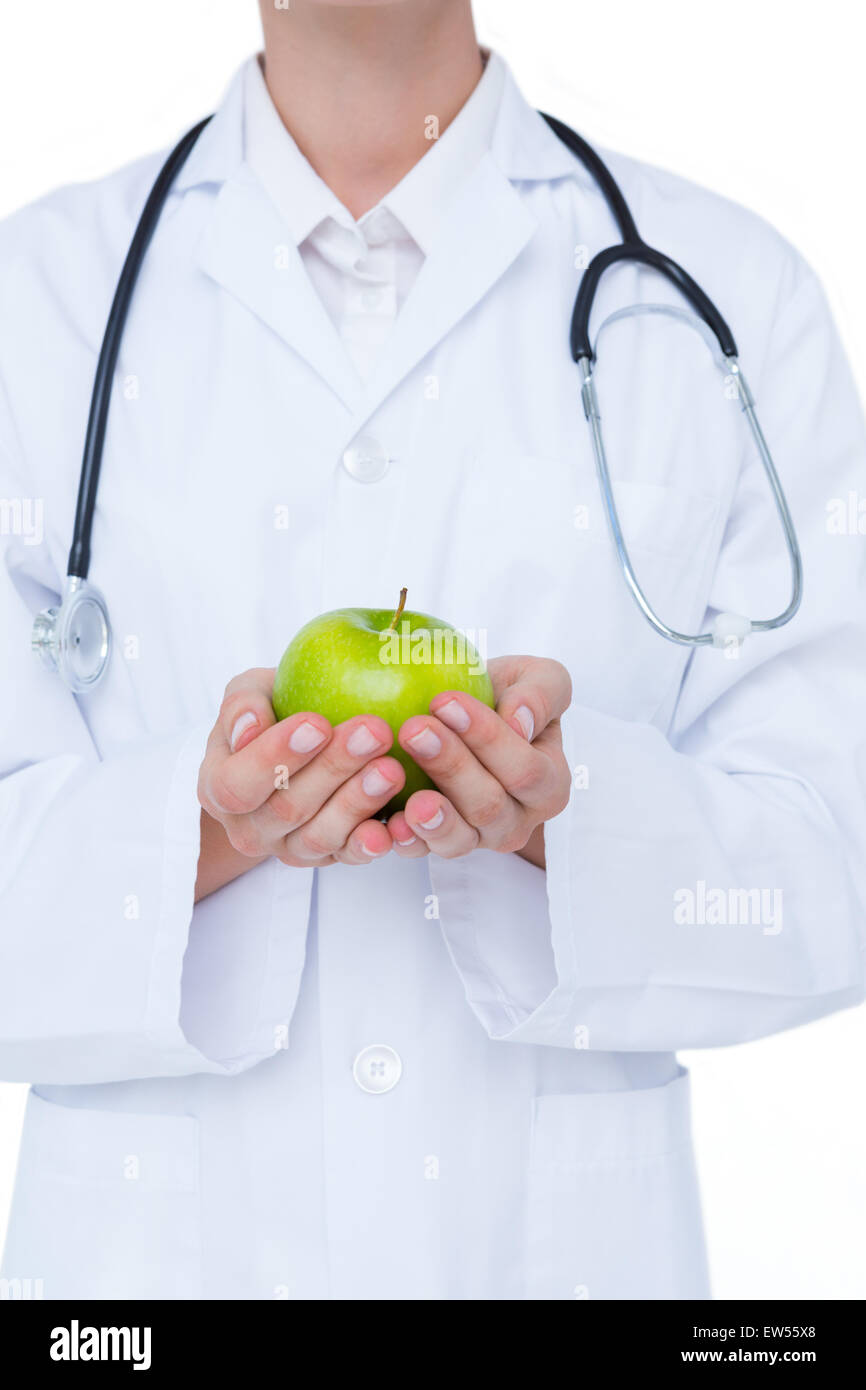 Doctor holding green apple Stock Photo