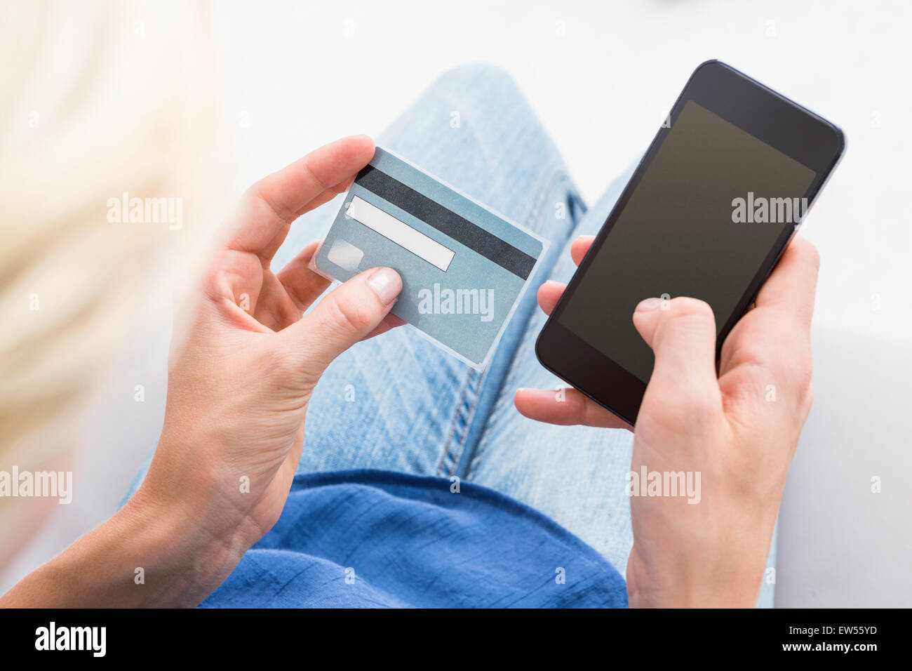 Woman doing online shopping with her mobile phone Stock Photo