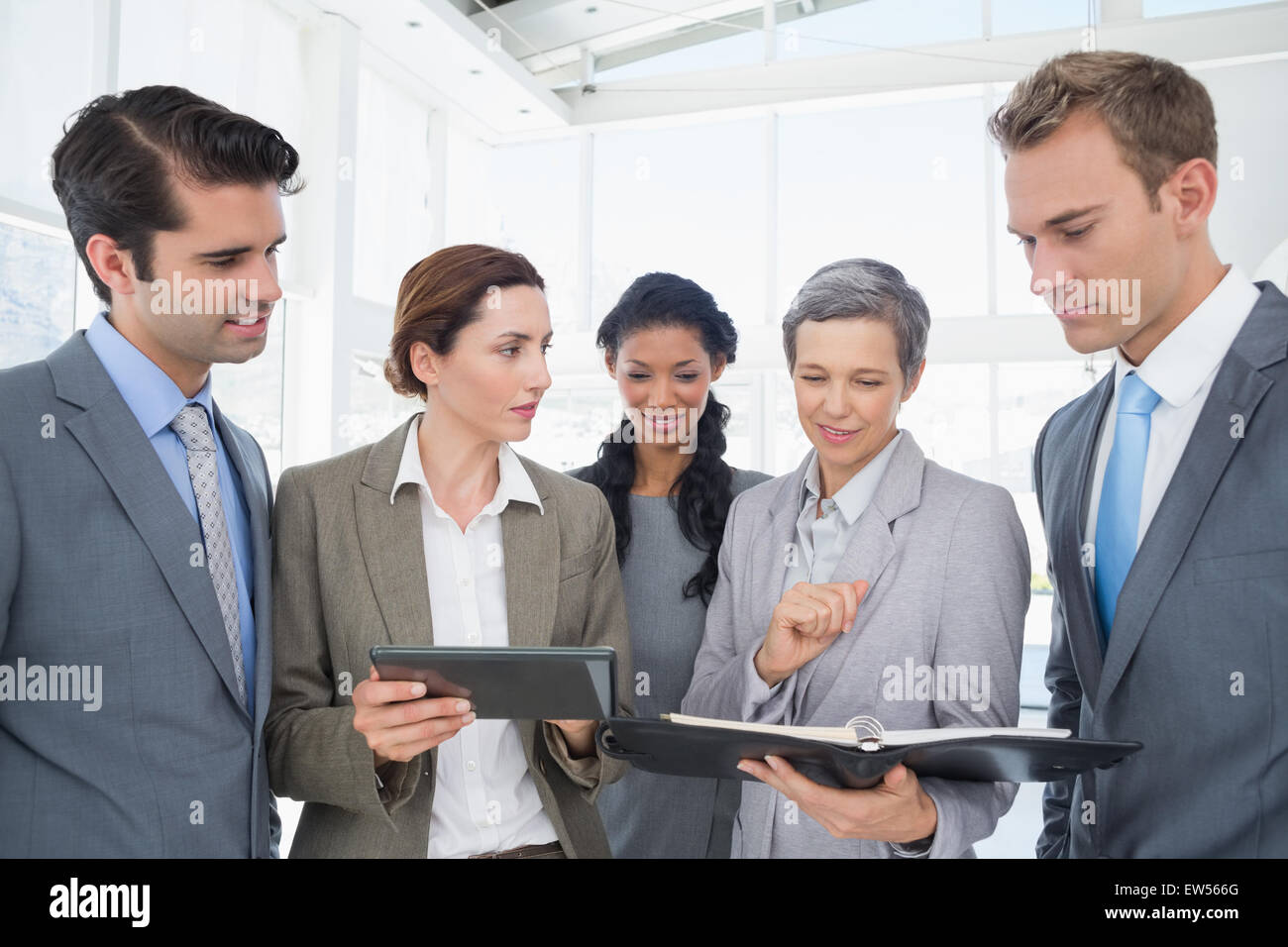 Business people with tablet and notebook Stock Photo