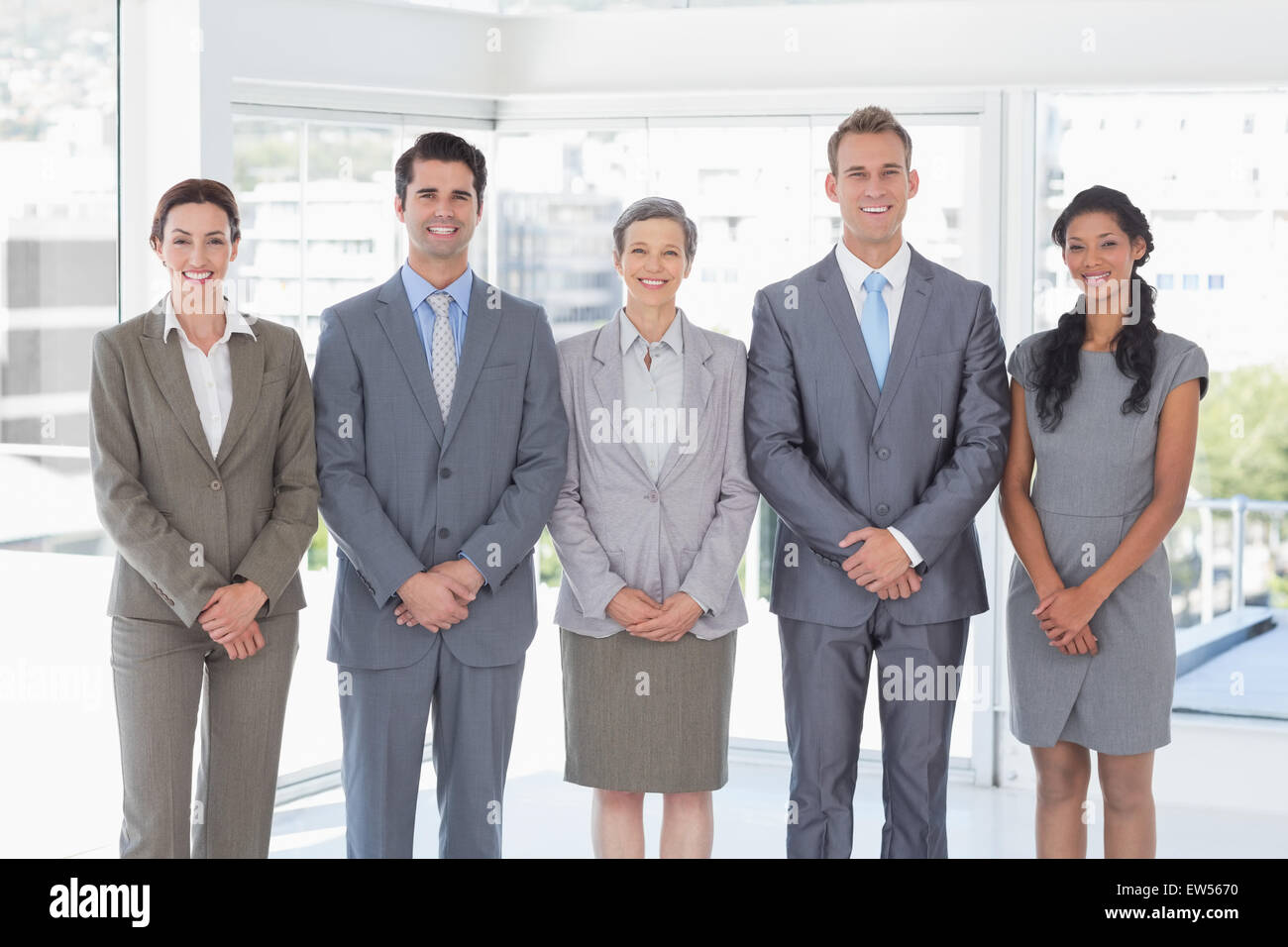 Business people standing in a row Stock Photo - Alamy