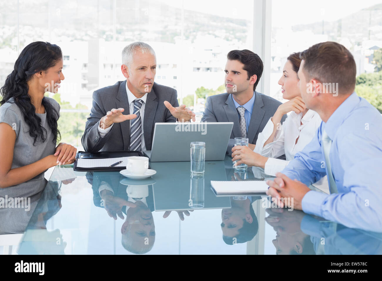 Business team working together on laptop Stock Photo - Alamy