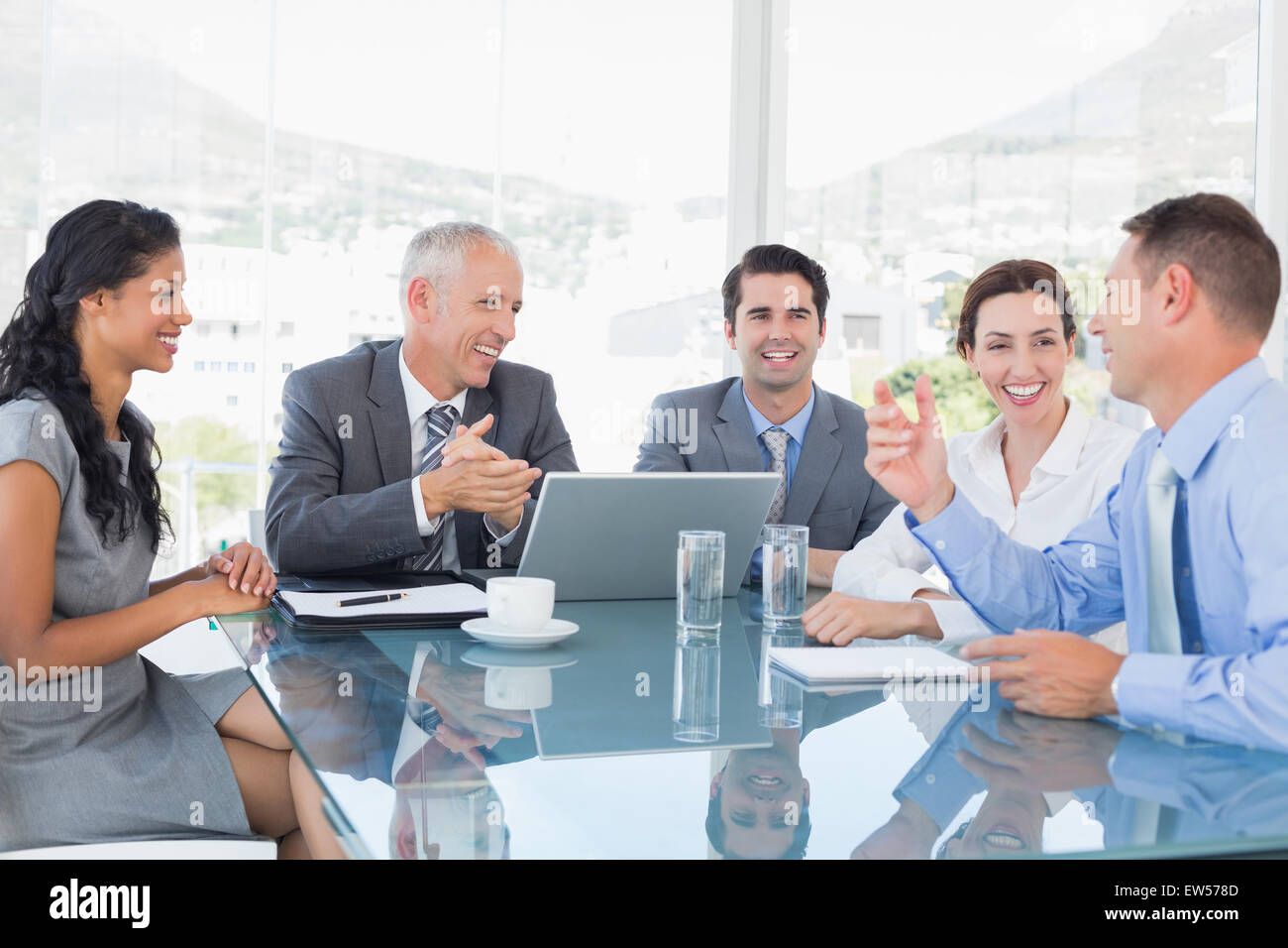 Business team laughing together Stock Photo