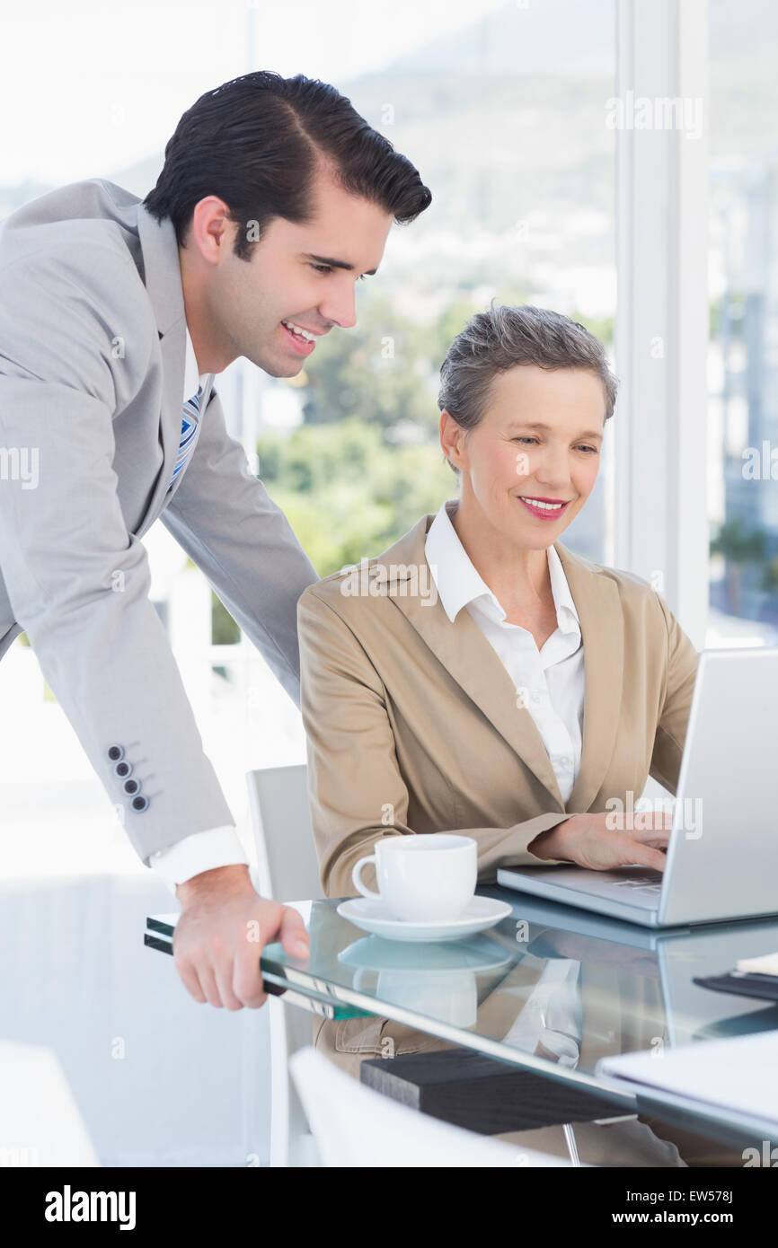 Business partners working on laptop Stock Photo