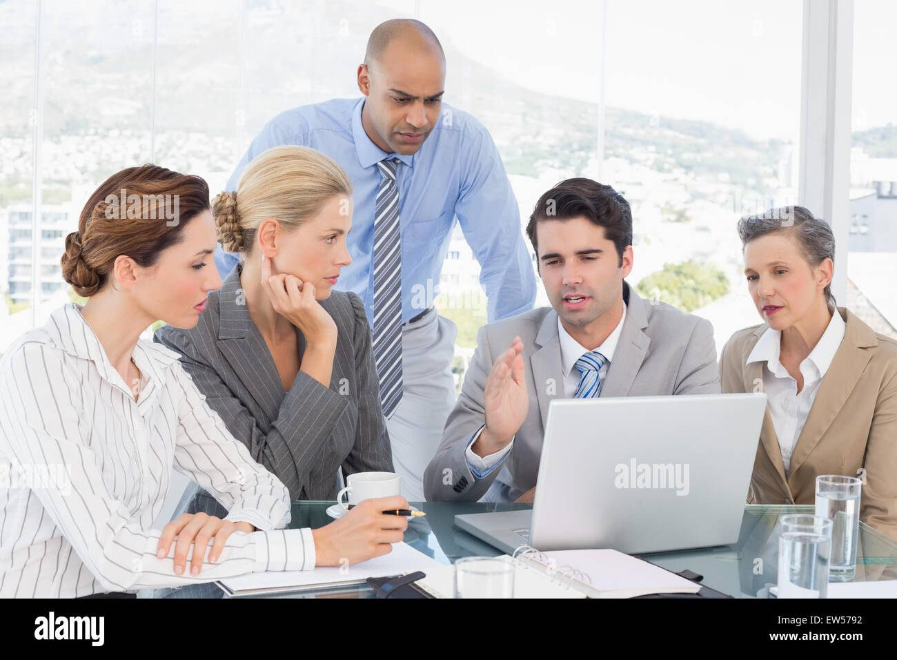 Business team working together on laptop Stock Photo - Alamy