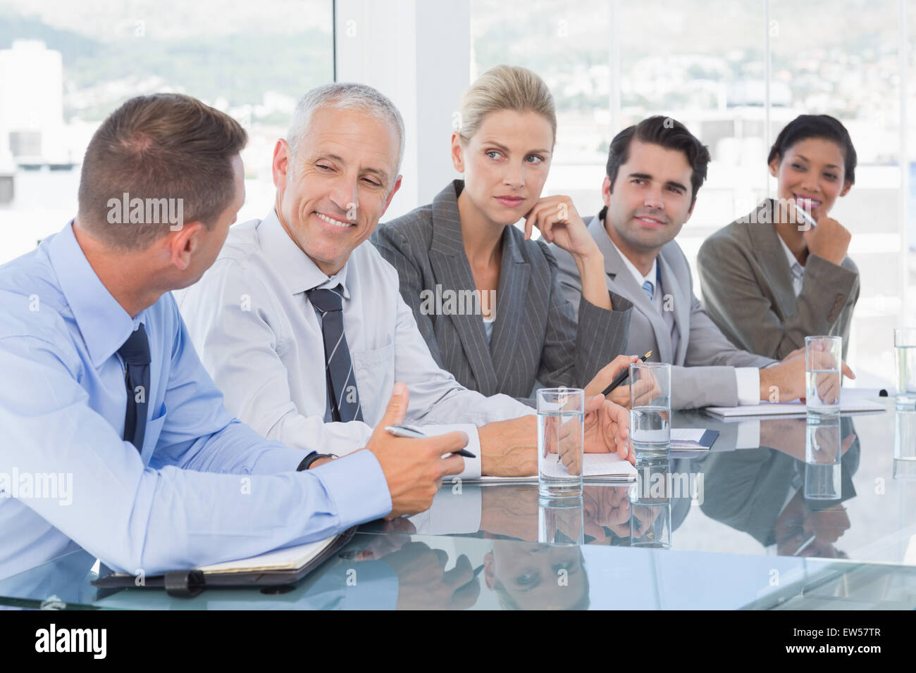 Business team having conversation at conference Stock Photo