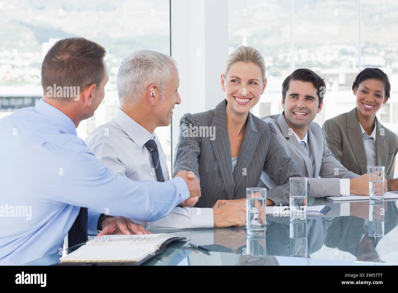 Business people shaking their hands Stock Photo