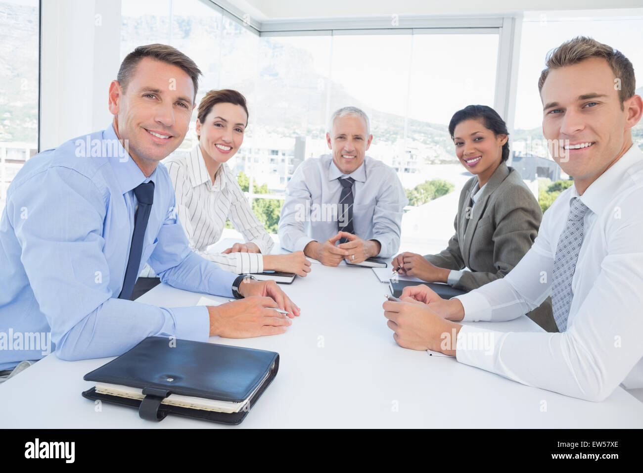 Business team sitting together around the table Stock Photo