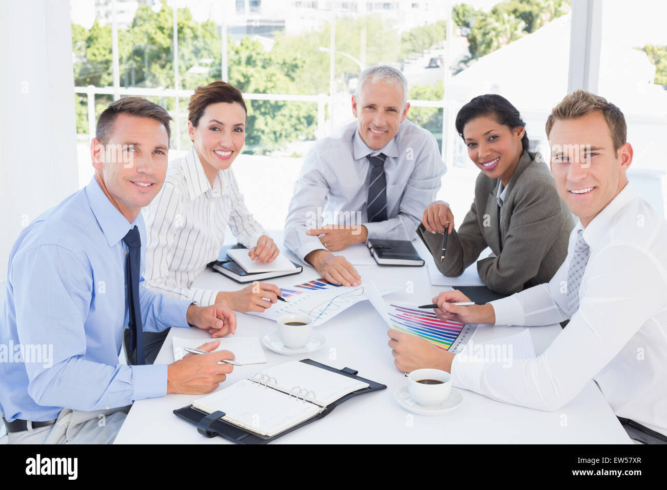 Business team analyzing the graphs Stock Photo