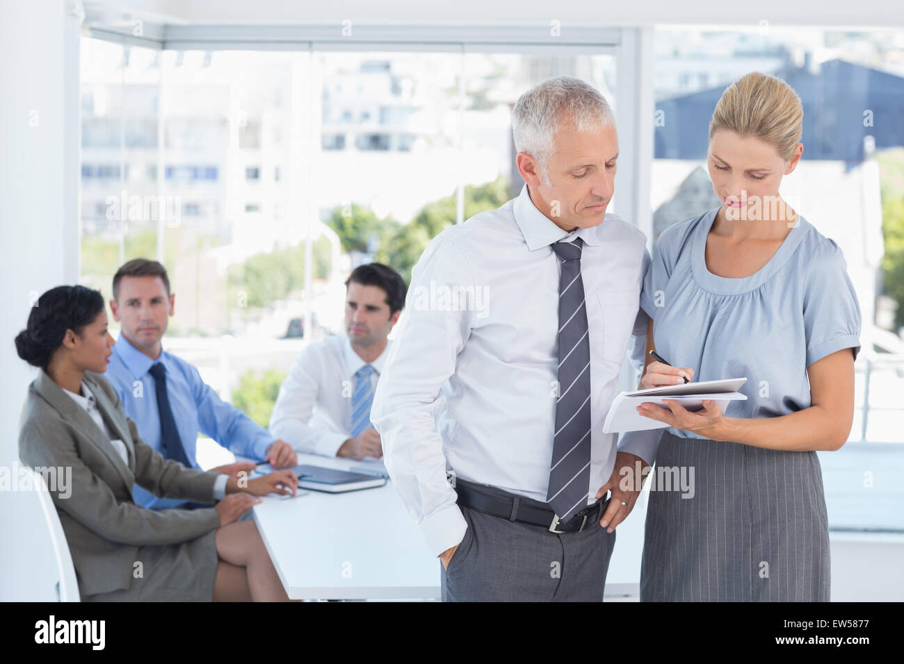Colleagues speaking about work Stock Photo