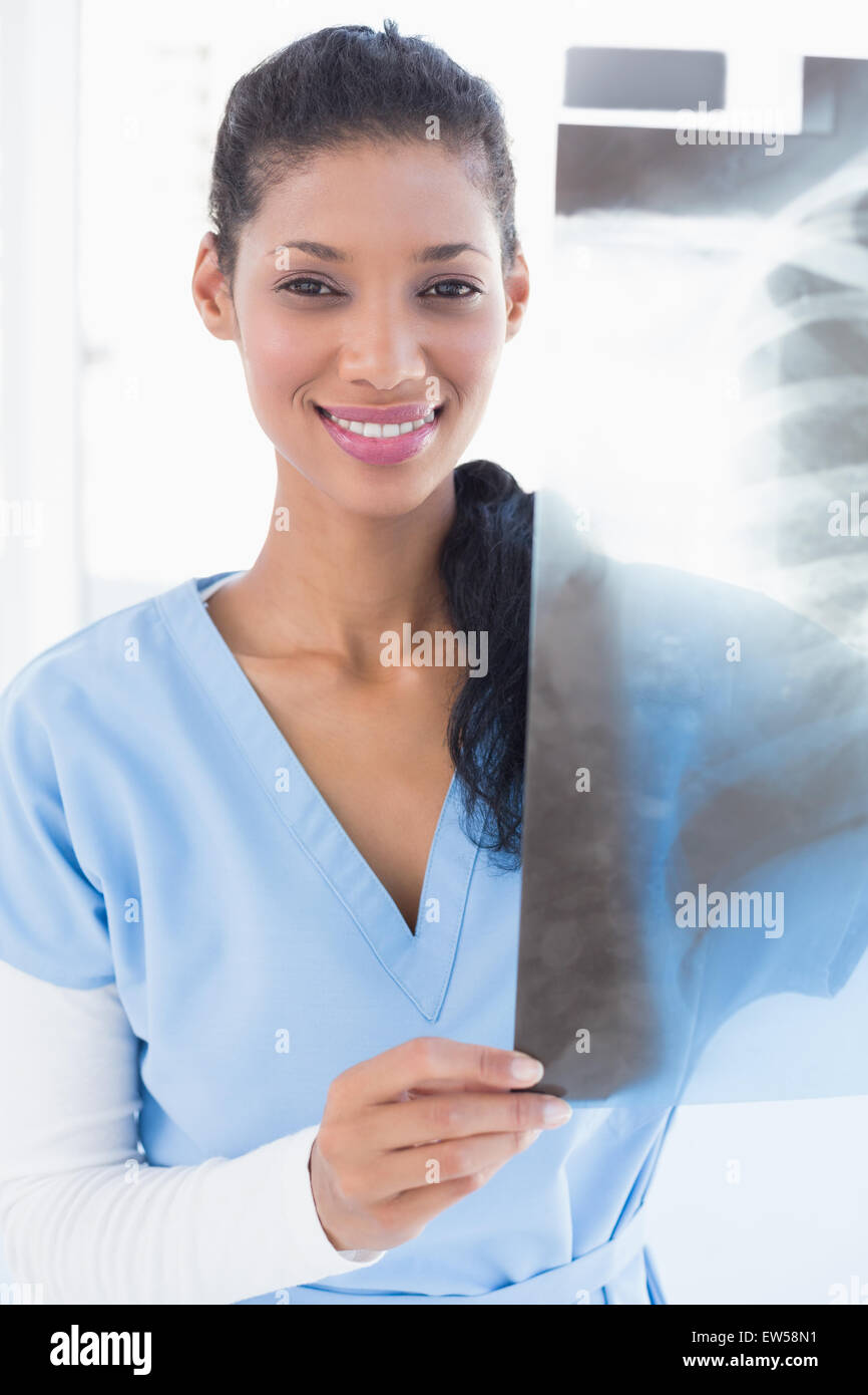 Smiling doctor analyzing xray Stock Photo