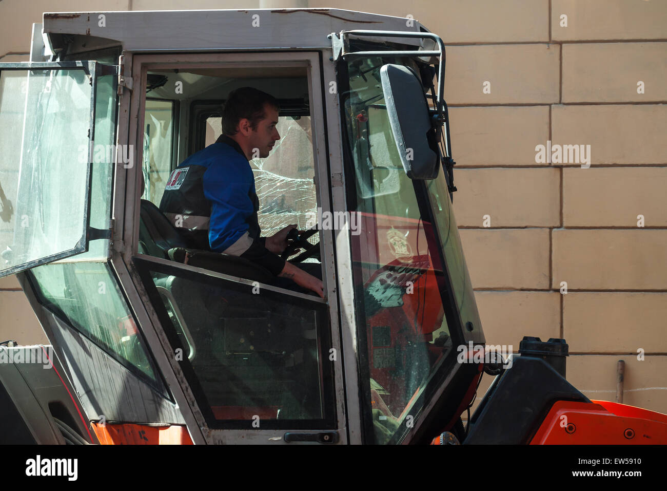 Saint-Petersburg, Russia - May 30, 2015: men at work, steam roller driver in the cabin Stock Photo