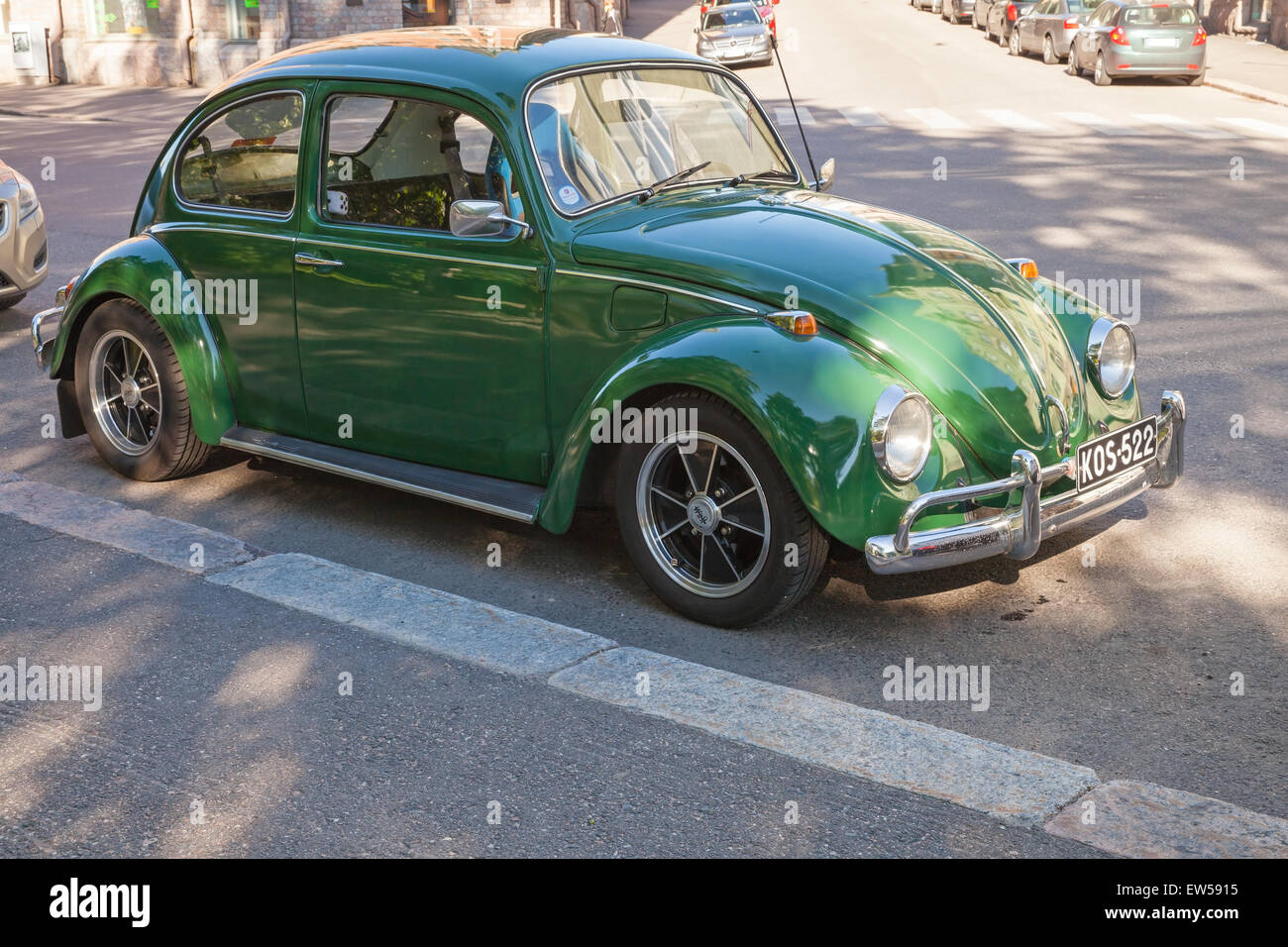 Helsinki, Finland - June 13, 2015: Green early 1966 Volkswagen Beetle car is parked on the street of Helsinki Stock Photo