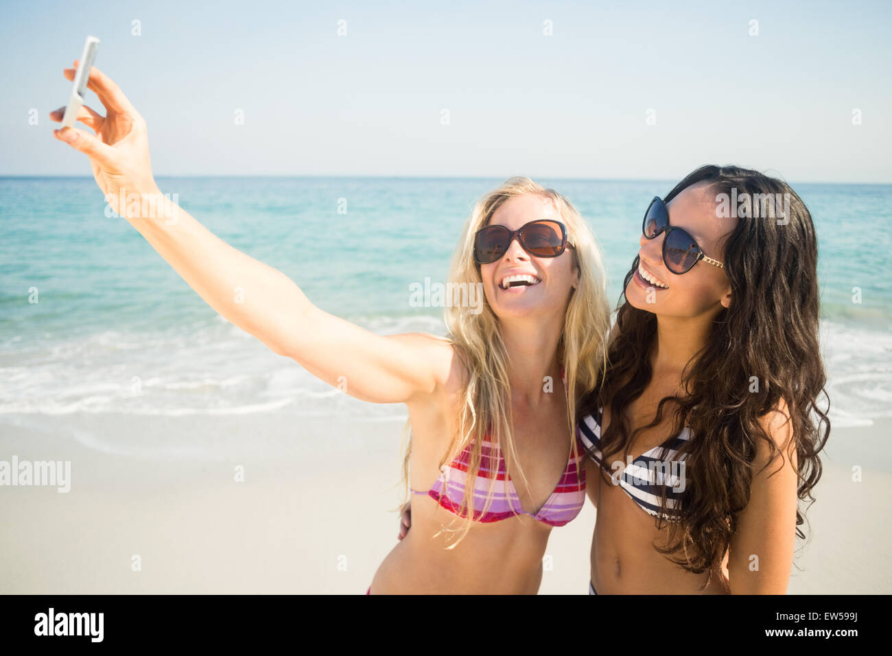 Two Friends In Swimsuits Taking A Selfie Stock Photo Alamy