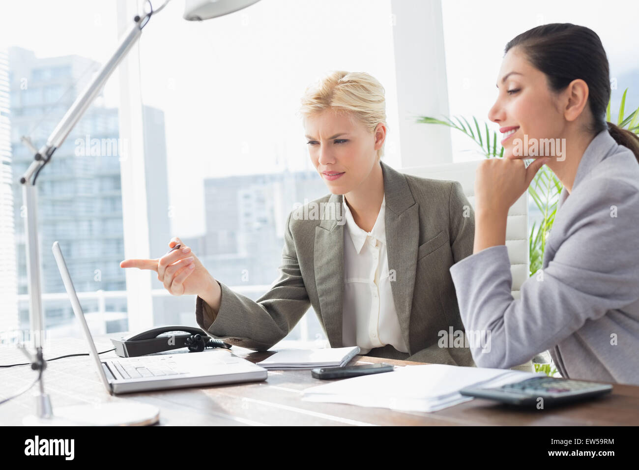 Businesswomen working together Stock Photo - Alamy