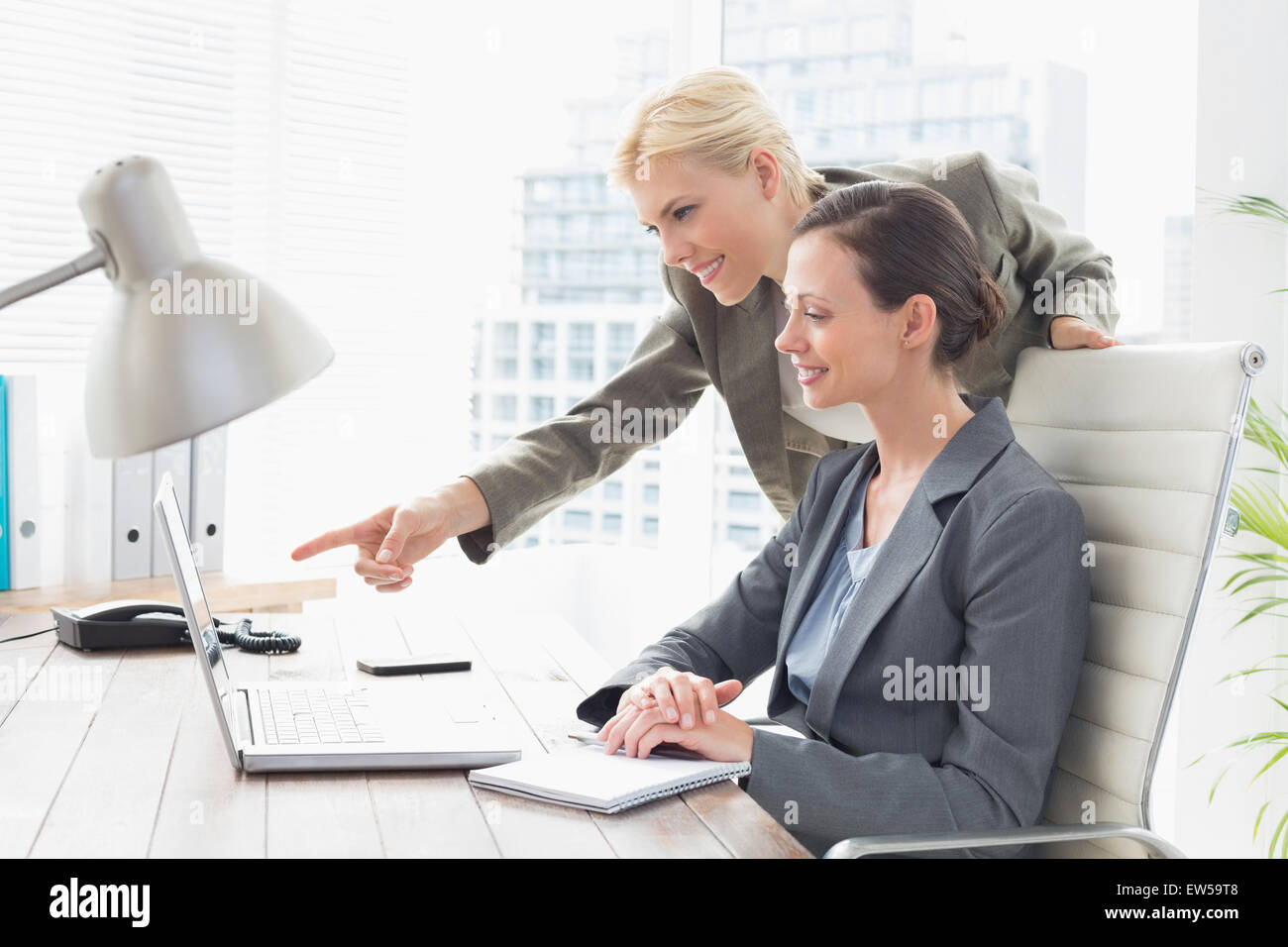Businesswomen working together Stock Photo - Alamy