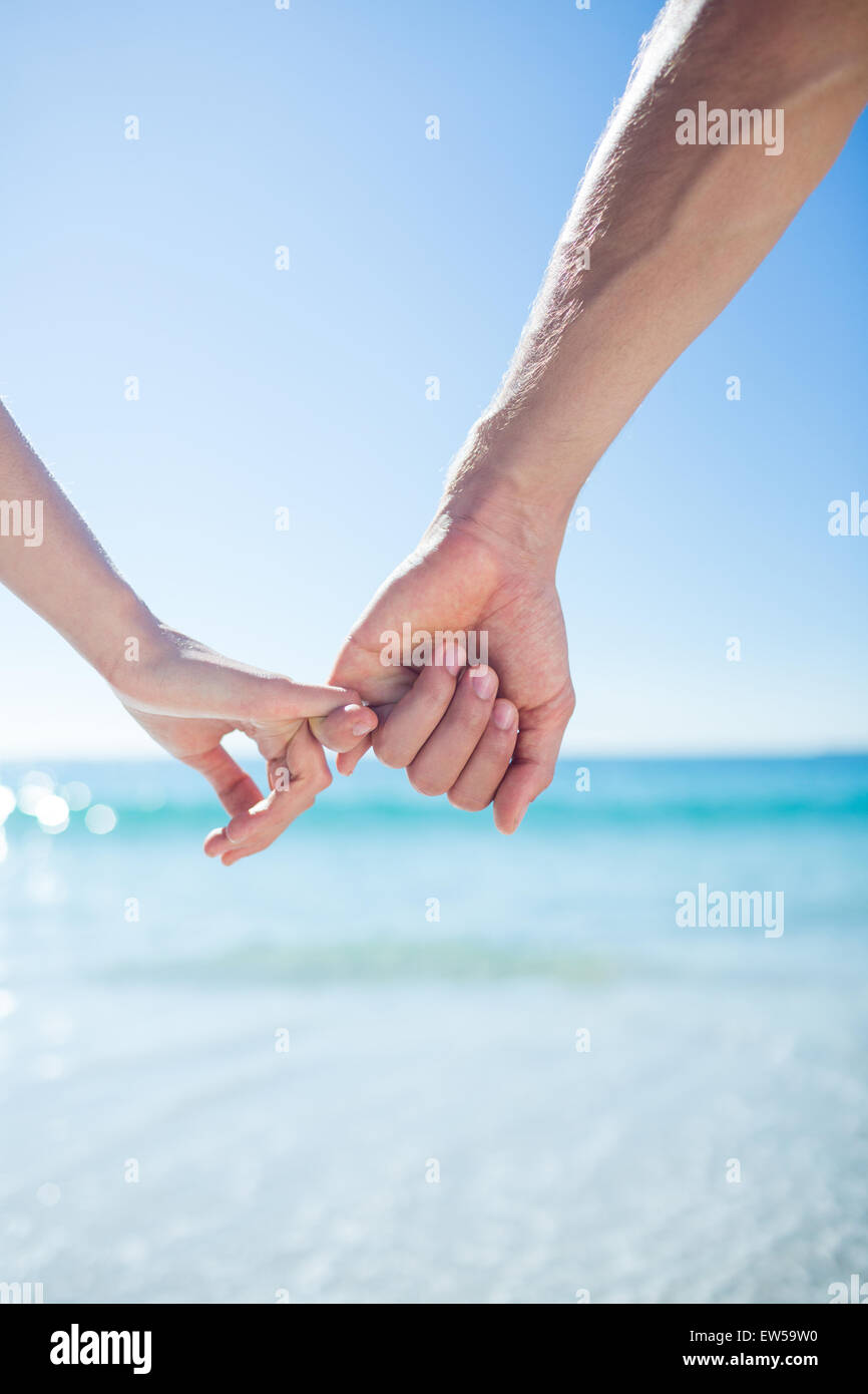 Couple walking hand in hand Stock Photo - Alamy