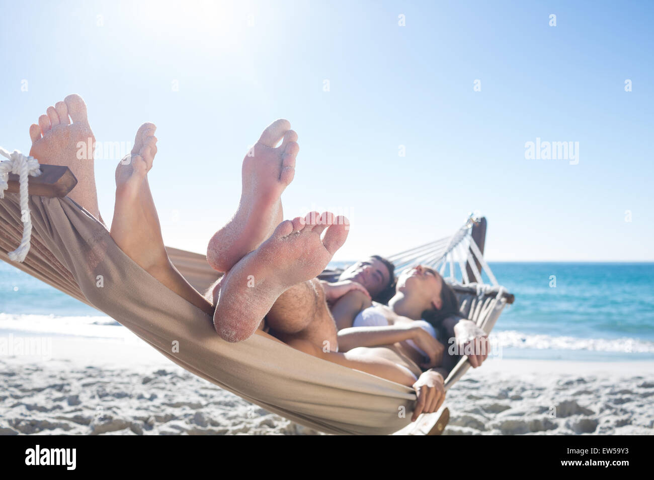 Happy couple napping together in the hammock Stock Photo