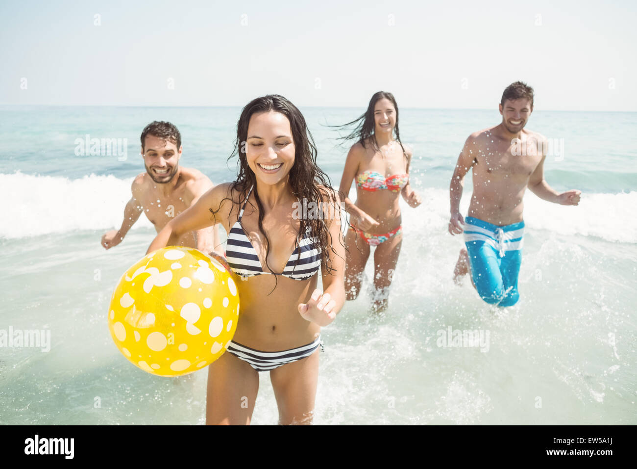group of friends in swimsuits having fun on the sea Stock Photo