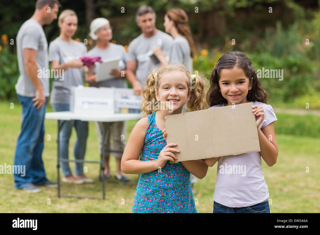 Happy children holding blank Stock Photo - Alamy
